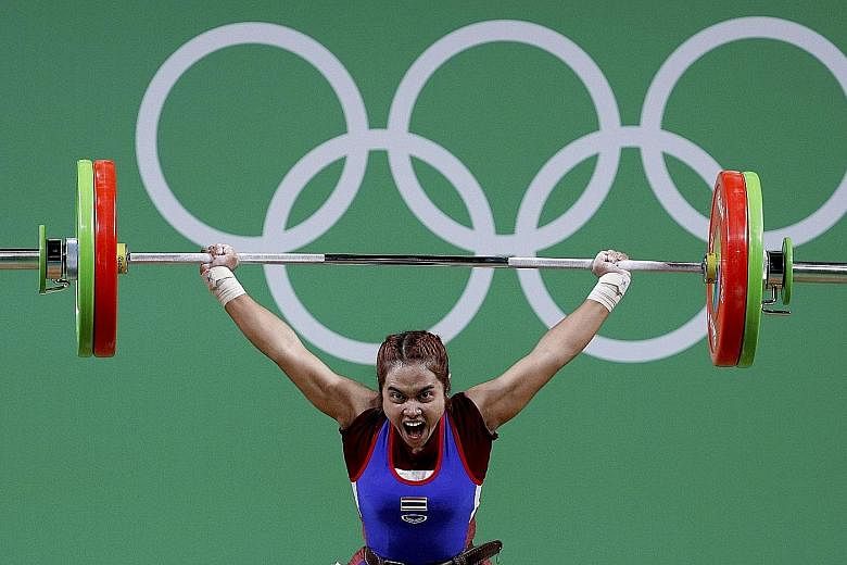 Sopita Tanasan on her way to clinching Thailand's first gold in Rio. The Thai capitalised on the absence of China's Hou Zhihui by lifting 200kg, 8kg more than Indonesian silver medallist Sri Wahyuni Agustiani's total.