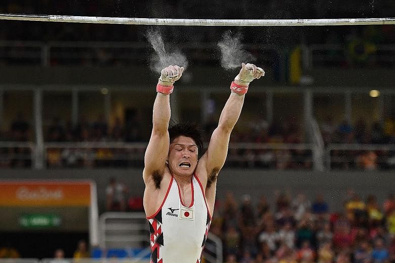Kohei Uchimura falling off the horizontal bar during qualifying for the artistic gymnastics team final at the Olympic Arena. His mistake sowed doubts in Japan's bid to topple their Asian rivals China.