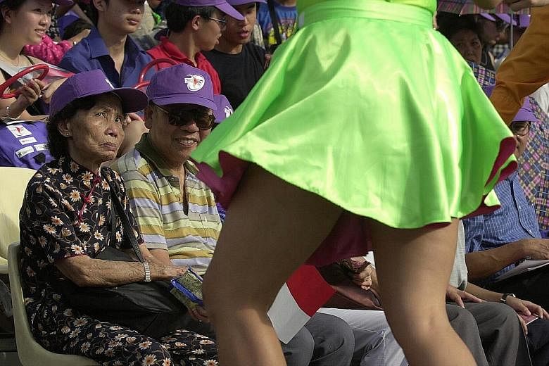 An elderly couple watching Lindy Hop dancers at the Padang during the NDP preview show in 2000.