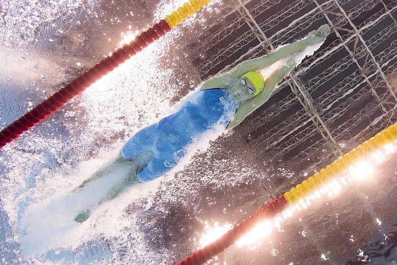 Clockwise, from left: Sweden's Sarah Sjostrom, as seen by an underwater camera, during her 100m butterfly win in a world-record time of 55.48sec. Katie Ledecky of the United States on the podium after winning the 400m freestyle in 3min 56.46sec, taki
