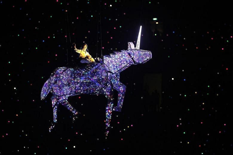 Left: Kai steals the show and many hearts as he rides on a unicorn flying nine storeys high. To prepare for his role, he spent 16 hours in flight training. The item was a reference to the Prime Minister's comparison of Singapore to the "one of a kind