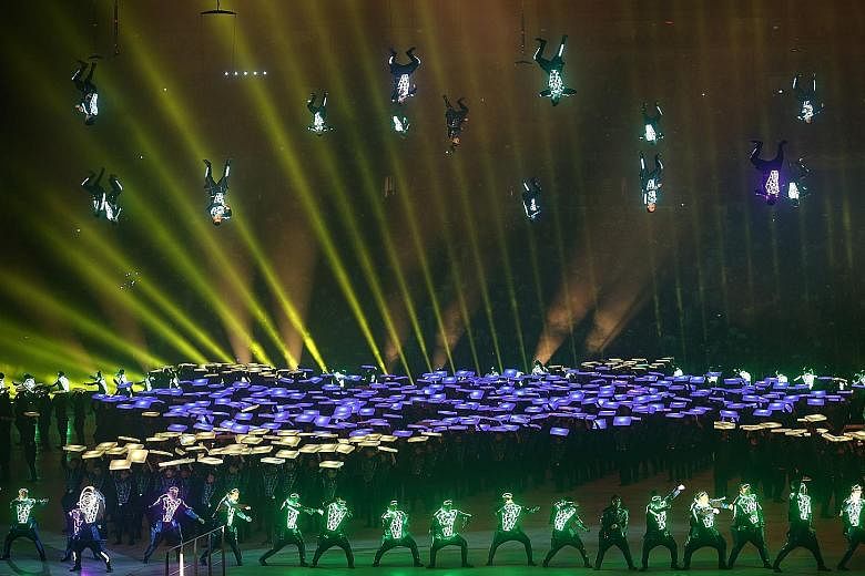 Like a scene from a science fiction movie, 20 aerialists from the SAF Music and Drama Company spin in midair while 720 performers from Commonwealth Secondary School, Kranji Secondary School and the Academy of Nutz dance to the tune of the future, cla