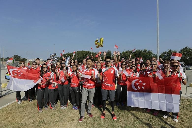 They may be more than 15,000km away in Rio de Janeiro, but that did not stop Minister for Social and Family Development Tan Chuan-Jin (front, left), who is also the president of the Singapore National Olympic Council, and Team Singapore's Olympic con
