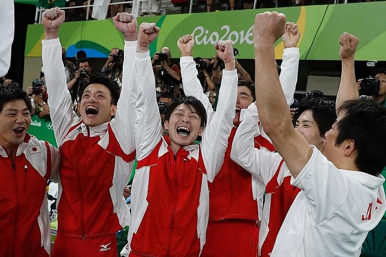 Top: Japan's Kohei Uchimura performing on the rings, setting his country on their way to gold in the artistic gymnastics team final at the Rio Olympic Arena. Left: The victorious Japanese team celebrating clinching their gold medal, and in doing so, 