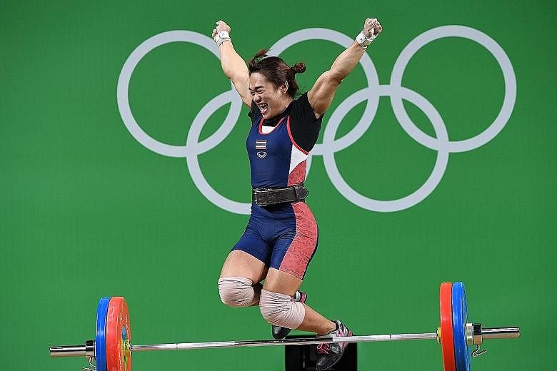 Thailand's Sukanya Srisurat celebrating her triumph in the women's 58kg class on Monday. She had served a two-year drug ban from 2011 to 2013 after testing positive as a 16-year-old for the anabolic steroid methandienone.
