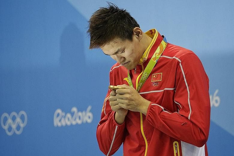 Sun Yang with his 200m freestyle gold medal. Fellow Olympians Michael Phelps and Lilly King had criticised the Chinese star, previously banned for doping, and fellow cheats.