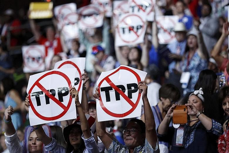 Delegates protesting against the Trans-Pacific Partnership at the first session of the Democratic National Convention in Philadelphia last month.