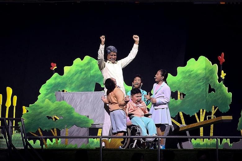 Anchoring the skit are actors (from left) R. Chandran, 60, Shadrach Yankaya (back facing), nine, Bryan Cheong (on wheelchair), 10, Jivan Wei Ramachandran, eight, and Nyla Esman, 11. Their skit called on Singaporeans to ponder about their hopes and dr