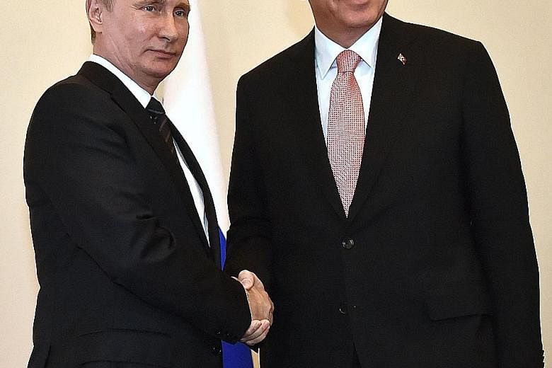 Mr Putin (left) welcoming Mr Erdogan to Saint Petersburg in their first encounter since Turkey downed one of Russia's warplanes last November, sparking a deep diplomatic crisis.