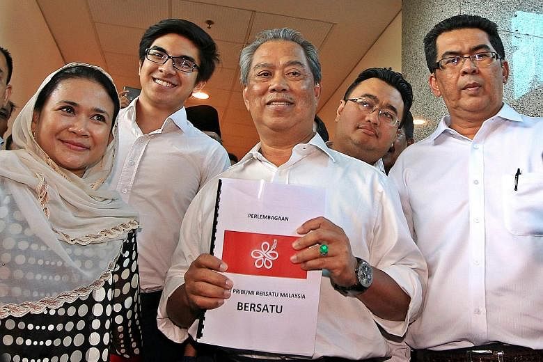Mr Muhyiddin, holding a proposed logo for the new Parti Pribumi Bersatu Malaysia, with several of its interim leaders after applying to register it. Mr Muhyiddin said the party is "inclusive, progressive and open-minded". He will be the president of 