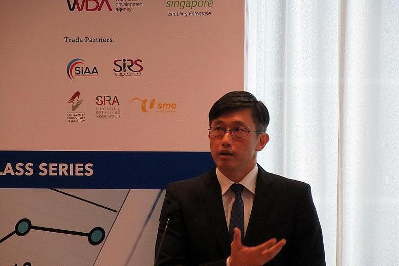Mr Teo, Minister of State for Manpower, speaking at the launch of a Retail Best Practices Masterclass programme yesterday at the NTUC Centre in Raffles Place. He urged retailers to take a hard look at their business models to remain competitive.