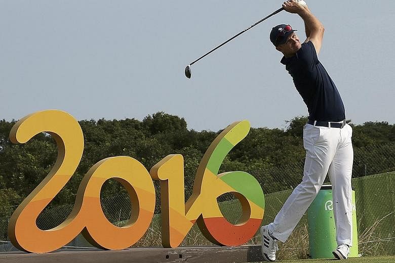 British golfer Justin Rose (left), teeing off during practice in Rio, and Rickie Fowler of the US are among only eight of the world's top 20 golfers to make it to the Games.