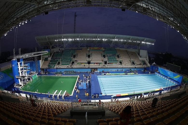 The Maria Lenk Aquatics Centre's diving pool water (left) contrasts sharply with the normal light-blue of the adjacent water-polo pool. Water tests on the diving pool found there was no risk to athletes' health, said Mr Simon Langford, the venue's me