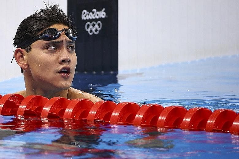 Joseph Schooling checking his time after his 100m free semi-final. While he was the slowest of the 16 swimmers in 48.70sec, he can take heart from his national record of 48.27 in the heats, in which he was sixth overall.