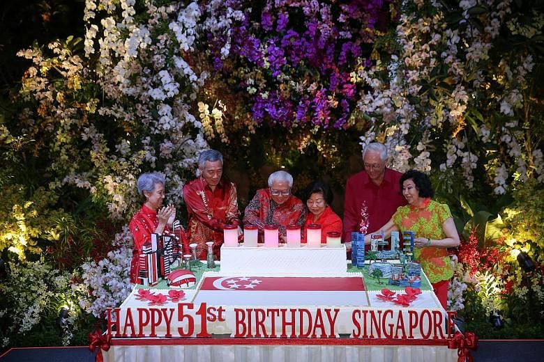 President Tony Tan Keng Yam and his wife Mary are joined by Prime Minister Lee Hsien Loong, Mrs Lee, Emeritus Senior Minister Goh Chok Tong and Mrs Goh at a birthday cake-cutting ceremony at the National Day Reception yesterday evening at the Flower 