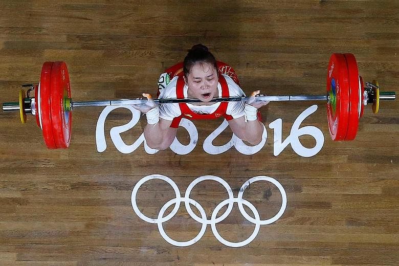 Chinese weightlifter Deng Wei making quick work of the 63kg event. She won by a clear 14kg ahead of North Korea's silver medallist Choe Hyo Sim, setting a world record along the way.