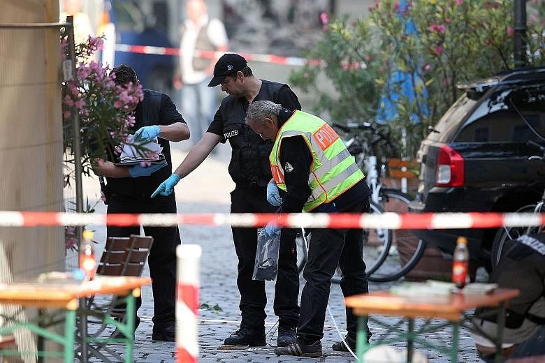 Investigators at the site of a suicide bombing in Ansbach, Germany, last month.