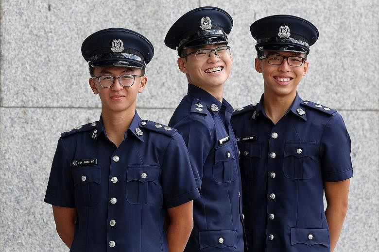 The three Singapore Police Force Scholarship recipients who received their awards yesterday (from left): Mr Lua Jiong Wei, Mr Kagen Lim and Mr Justin Tan.