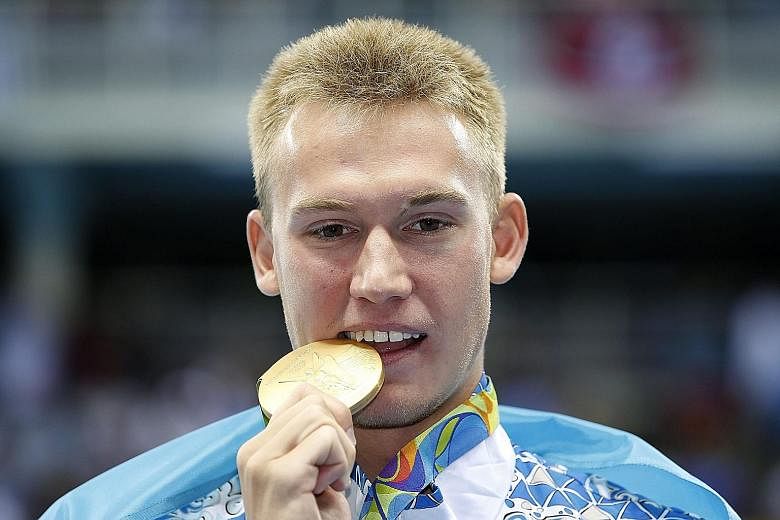 Dmitriy Balandin claims Kazakhstan's first swimming gold in the Games by winning the 200m breaststroke in 2min 7.46sec.