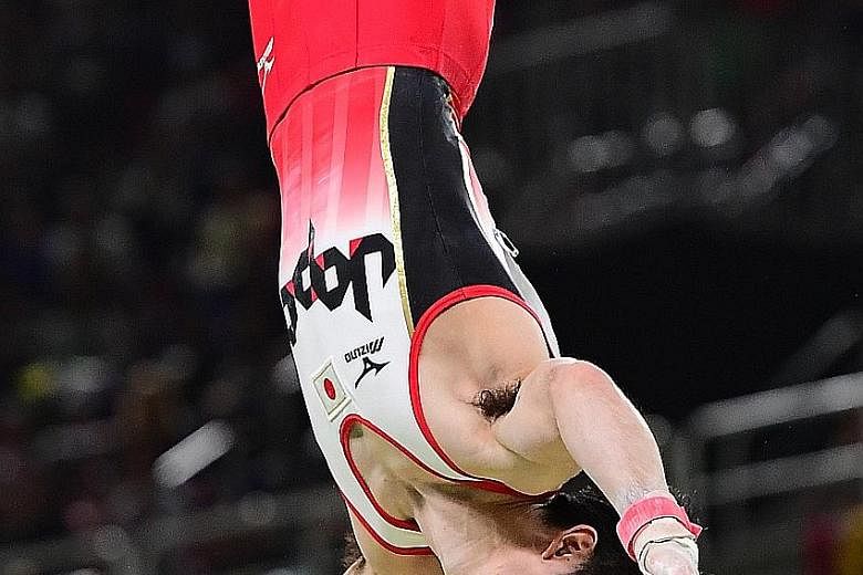 Japan's Kohei Uchimura performing on his final rotation, the horizontal bar, where he overtook Ukraine's Oleg Verniaiev to win the individual all-around crown on Wednesday. It was on this apparatus that he fell during qualification.
