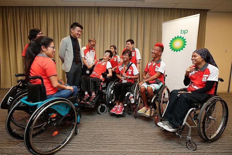 Parliamentary Secretary (Ministry of Culture, Community and Youth) Baey Yam Keng, with Singapore's Rio Paralympics chef de mission Ho Cheng Kwee on his left, sharing a laugh with (from left) swimmer Yip Pin Xiu, archer Nur Syahidah Alim, equestrians 