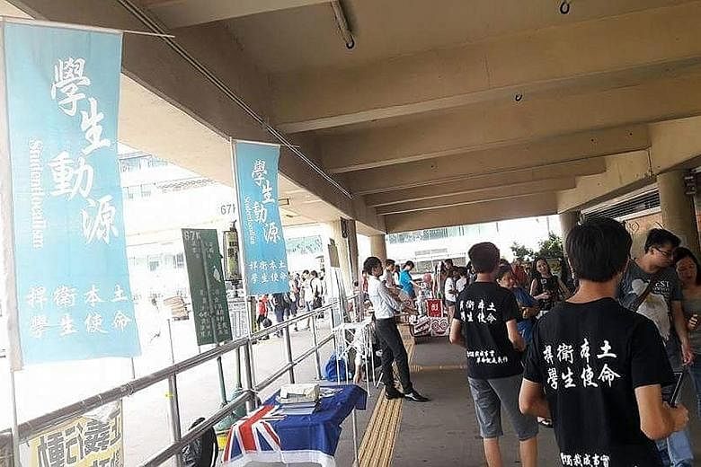 Hong Kong activist group Studentlocalism, founded in April, has been taking to the streets to canvass for the city to break away from China. The words on the T-shirts read: "Protect localism, the mission of students".