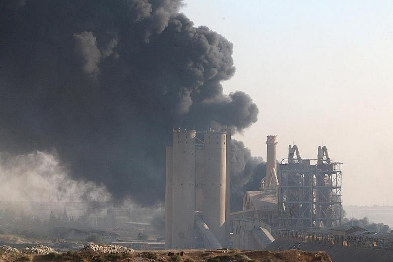 Smoke rising from a cement factory controlled by the Syrian regime in Aleppo. The battle for what was once Syria's largest city is seen as a crucial juncture in the ongoing conflict. But it is still unclear if the rebels can hold on to the recent gai