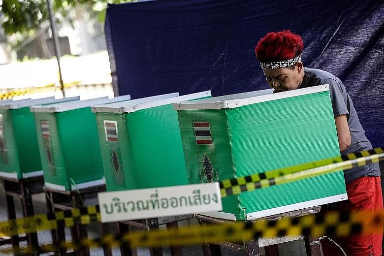 A woman votes during Thailand's constitutional referendum in Bangkok last Sunday. The results have sent a few important messages that, if well taken, could pave the way to solutions to some of the kingdom's deep-rooted problems.