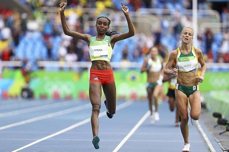 Ethiopian Almaz Ayana crossing the finish line to set a new world record in the 10,000m, with silver medallist Vivian Cheruiyot nowhere in sight.