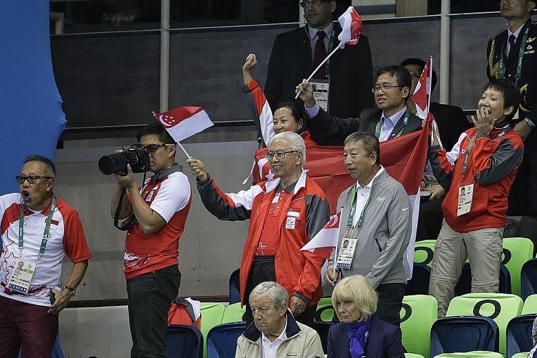 President Tony Tan and International Olympic Committee executive board member Ng Ser Miang supporting swimmers Joseph Schooling and Quah Zheng Wen at the Olympic Aquatics Stadium on Thursday. Dr Tan is on a five-day visit to Brazil.