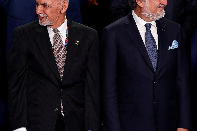 Mr Ghani (left) and Dr Abdullah at the Nato Summit in Warsaw last month.