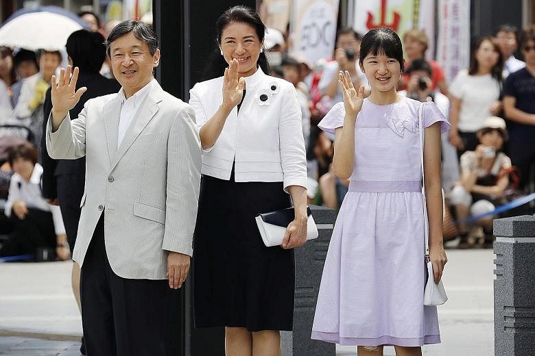Crown Prince Naruhito, his wife Crown Princess Masako and their daughter Princess Aiko waving as they arrived at a train station in Matsumoto, Nagano prefecture, last Wednesday.