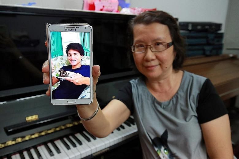 Ms Yim with a photo of her nephew. The music teacher said his talent and discipline was visible from a young age and he never missed a swim even on holiday in Ipoh as a child. Although the whole family was not able to be in Rio de Janeiro to cheer hi