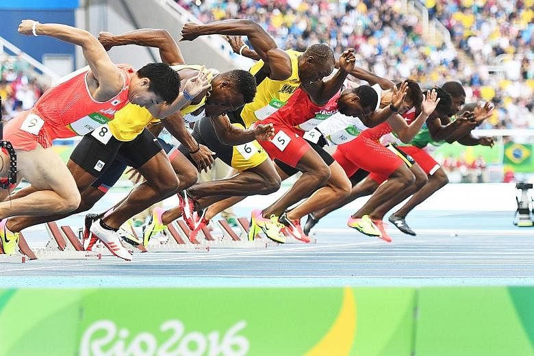Jamaica's Usain Bolt (fourth from left) on his way to winning his first-round 100m heat at the Olympic Stadium. He is aiming to win a third straight gold in the event in this morning's final.