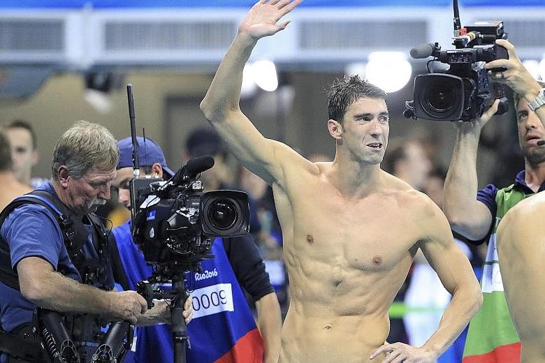 An emotional Michael Phelps waving his farewell from beside the Olympic pool after finishing his final swim at the Games with a "cherry on the top of the cake" 23rd gold in the 4x100m medley relay.