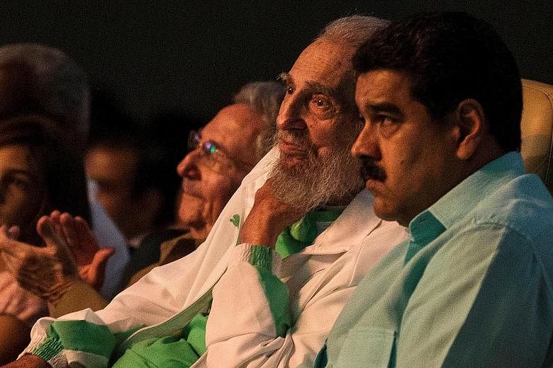 Mr Fidel Castro (centre) with Cuban President Raul Castro (left) and Venezuelan leader Nicolas Maduro at a gala for his birthday in Havana.