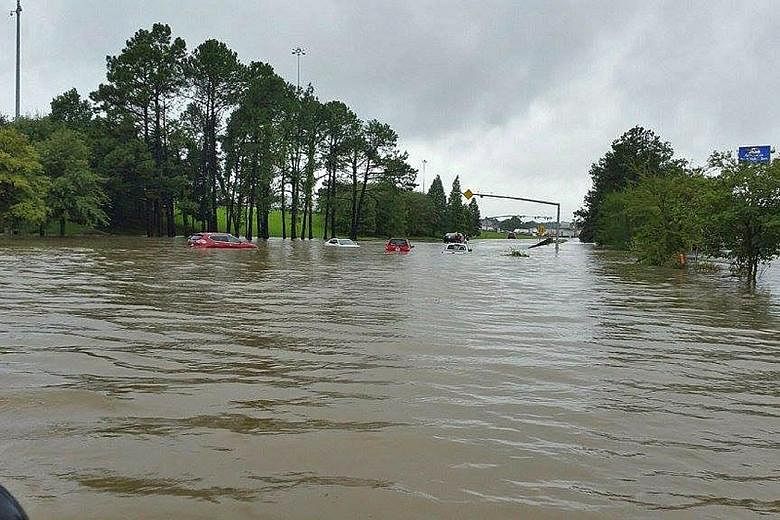 A flooded road in Denham Springs, Louisiana. The National Weather Service described the flooding in the state as "catastrophic".