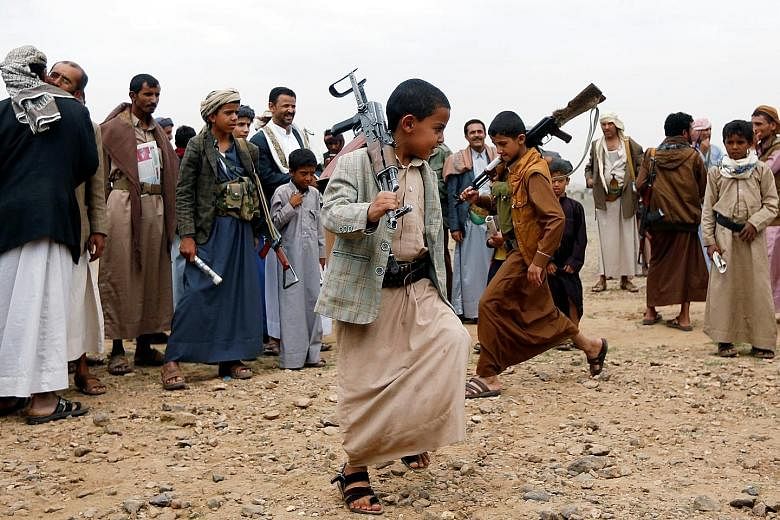 Armed boys performing the traditional Baraa dance at a tribal gathering held by tribesmen loyal to the Huthi movement. Unicef has warned that with the intensification in violence across Yemen in the past week, the number of children killed and injure