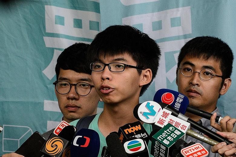 From left: Mr Law, Mr Wong and Mr Chow speaking to the media following their trial.