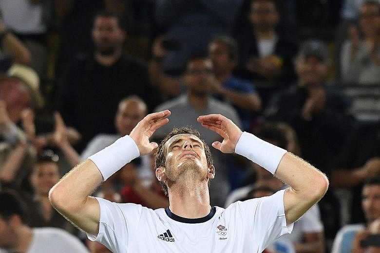 Britain's Andy Murray succumbs to emotion after becoming the first man to successfully defend his Olympic title. He outlasted Argentina's Juan Martin del Potro in four sets in Sunday's final.