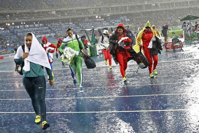 When it rains, it pours in Rio, as discus throwers were forced to leave the field when torrential rain put a halt to proceedings. Sandra Perkovic of Croatia later flung 69.21m in the final to win gold, in drier conditions.
