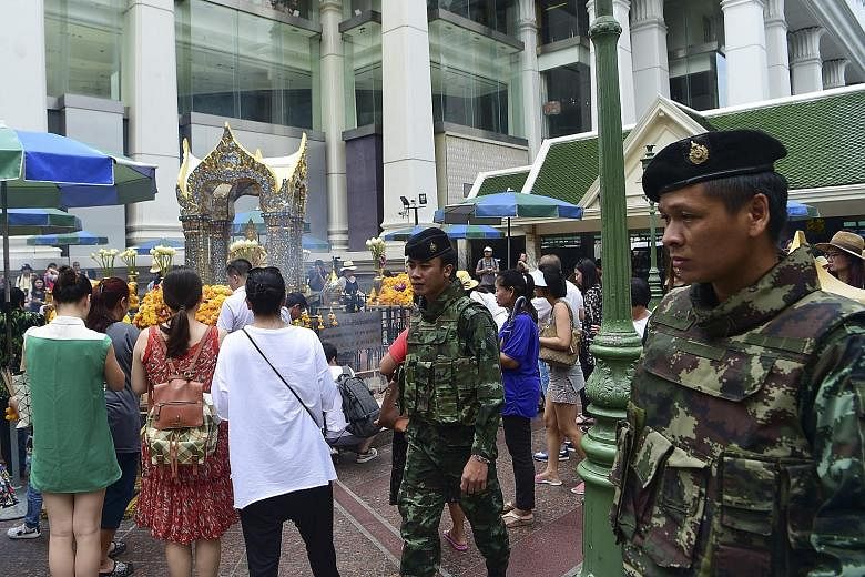 Thai soldiers patrolling near Erawan Shrine in Thailand's capital, Bangkok. The country was rocked by a wave of bomb attacks last week that killed four and injured dozens.