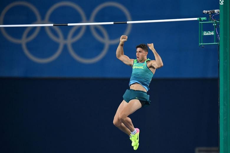 Brazil's Thiago Braz da Silva leaving his fists pumped on the way down from clearing one of his attempts in the pole vault final. He upset Frenchman Renaud Lavillenie with the backing of the partisan Rio crowd.
