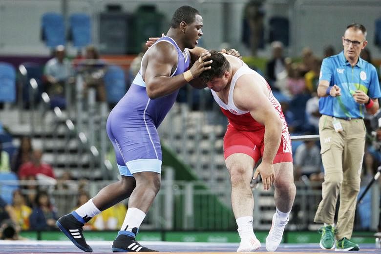 Who said big men can't dance? Mijain Lopez of Cuba, who weighs 130kg, performing an impromptu series of dance moves after defeating arch-rival Riza Kayaalp of Turkey 6-0 in the Greco-Roman super- heavyweight event on Monday