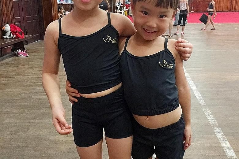 Kayla See, six, and sister Jana, four, have weekly gymnastics classes. Their father, Mr See, says Schooling's win has given him hope. Jana has been identified by her coach to have competitive potential.