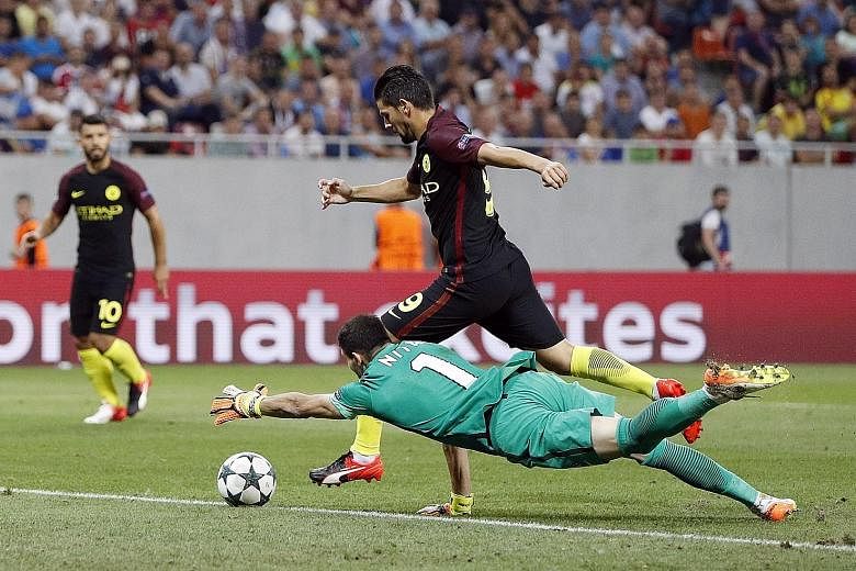 Man City's new signing Nolito going round Steaua Bucharest goalkeeper Florin Nita to score their third goal in their 5-0 Champions League rout.