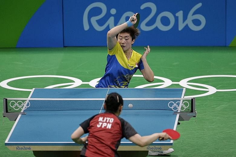 Team captain Feng Tianwei netting a forehand during her 9-11, 4-11, 6-11 loss to Japan's 15-year-old Mima Ito during the women's team bronze medal play-off on Tuesday.
