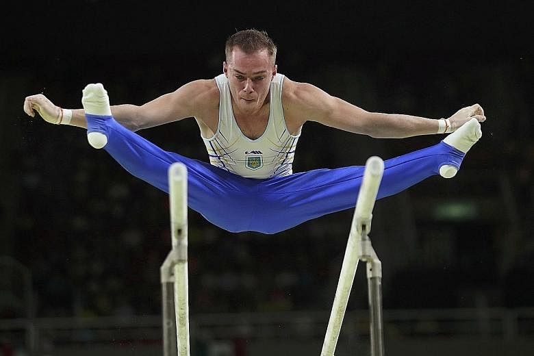 Top: Oleg Verniaiev's victory on the parallel bars was Ukraine's first gold medal of these Games. Germany's Fabian Hambuchen wins the horizontal bar title after finishing third in Beijing and second in London.
