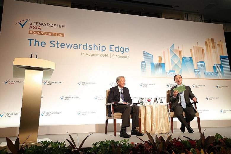 DPM Teo Chee Hean (left) at the Stewardship Asia Roundtable yesterday, with Mr Hsieh Fu Hua, the chairman of Stewardship Asia Centre, as moderator. Mr Teo said that sometimes, because government is not very effective, there is innovation because ther