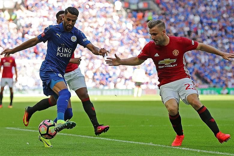 Mahrez (left), seen here in a match against Manchester United earlier this month, signed a deal that ties him to Leicester City until 2020.